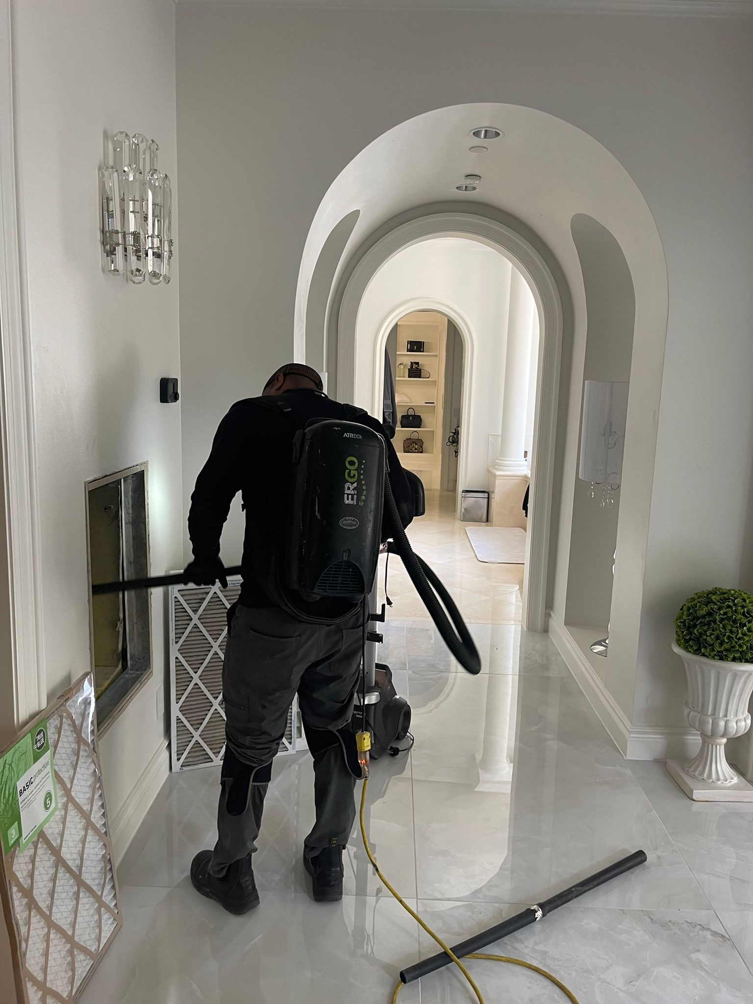 Professional Air Duct Cleaning Technician using HEPA Vacuum